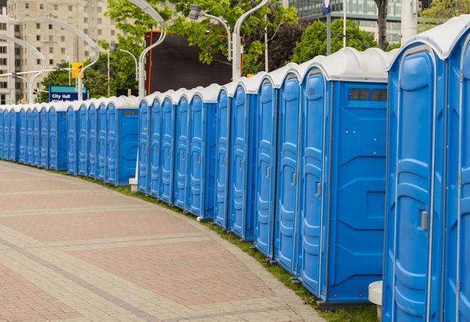 a line of brightly-colored portable restrooms, perfect for outdoor festivals and concerts in Apple Valley, MN